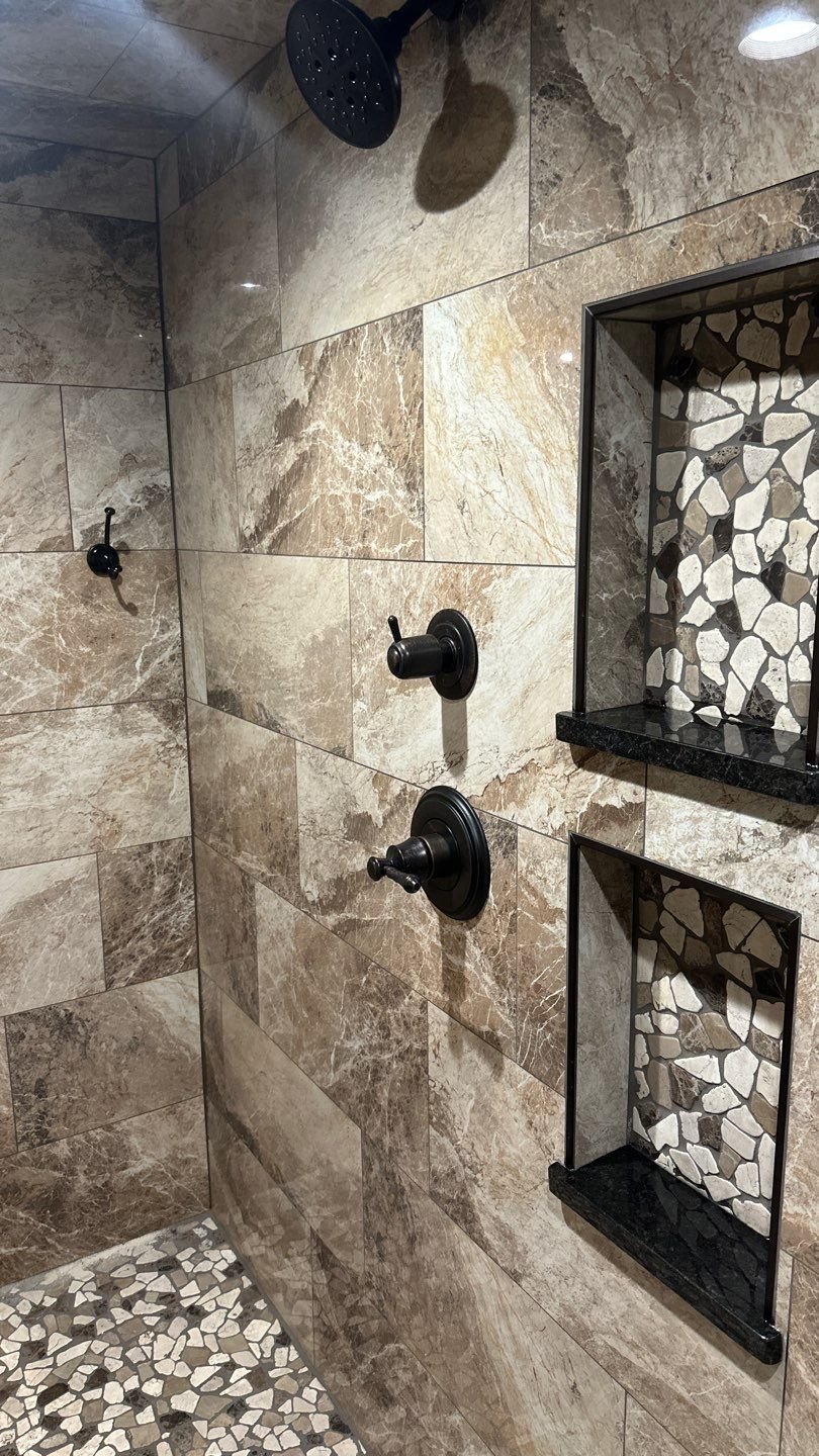 Custom shower fixtures and built-in niche detail by Crain Bros Inc in Northeast Arkansas