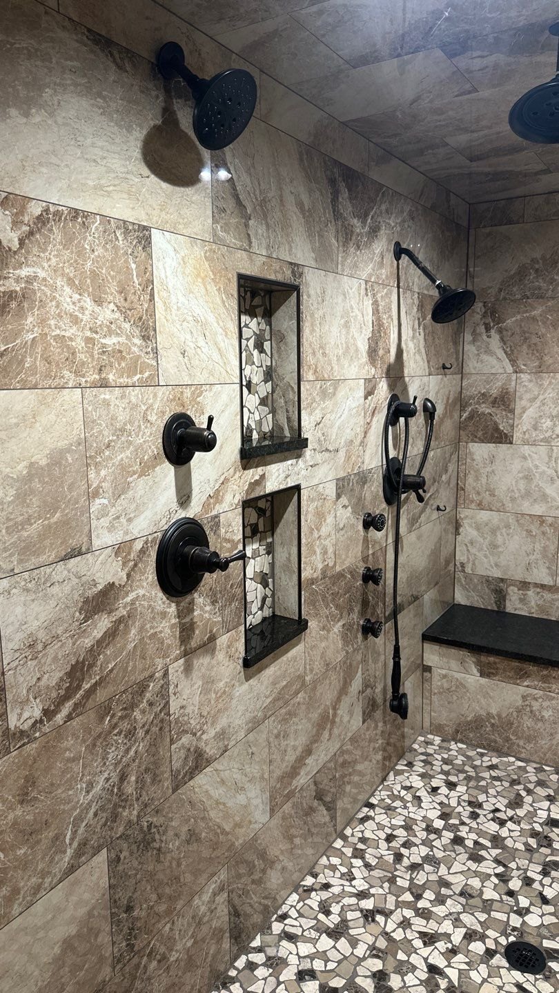 Custom shower wall tile, fixtures, and storage niches by Crain Bros Inc in Northeast Arkansas