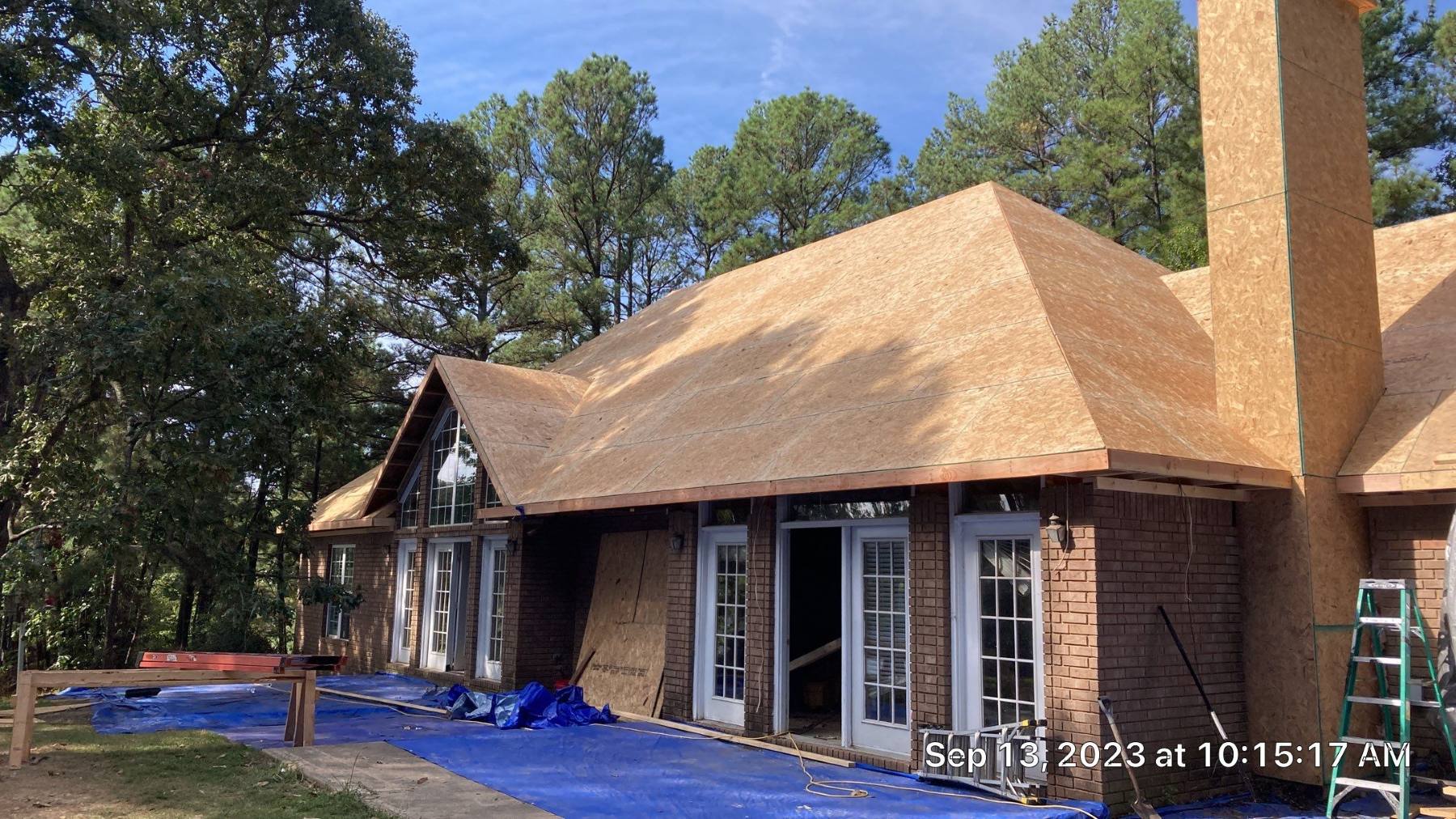 Extensive roof and chimney reconstruction after removal of fire-damaged structural materials