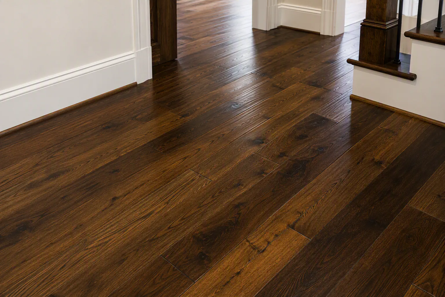Stained wood flooring with varied plank shades and grain.