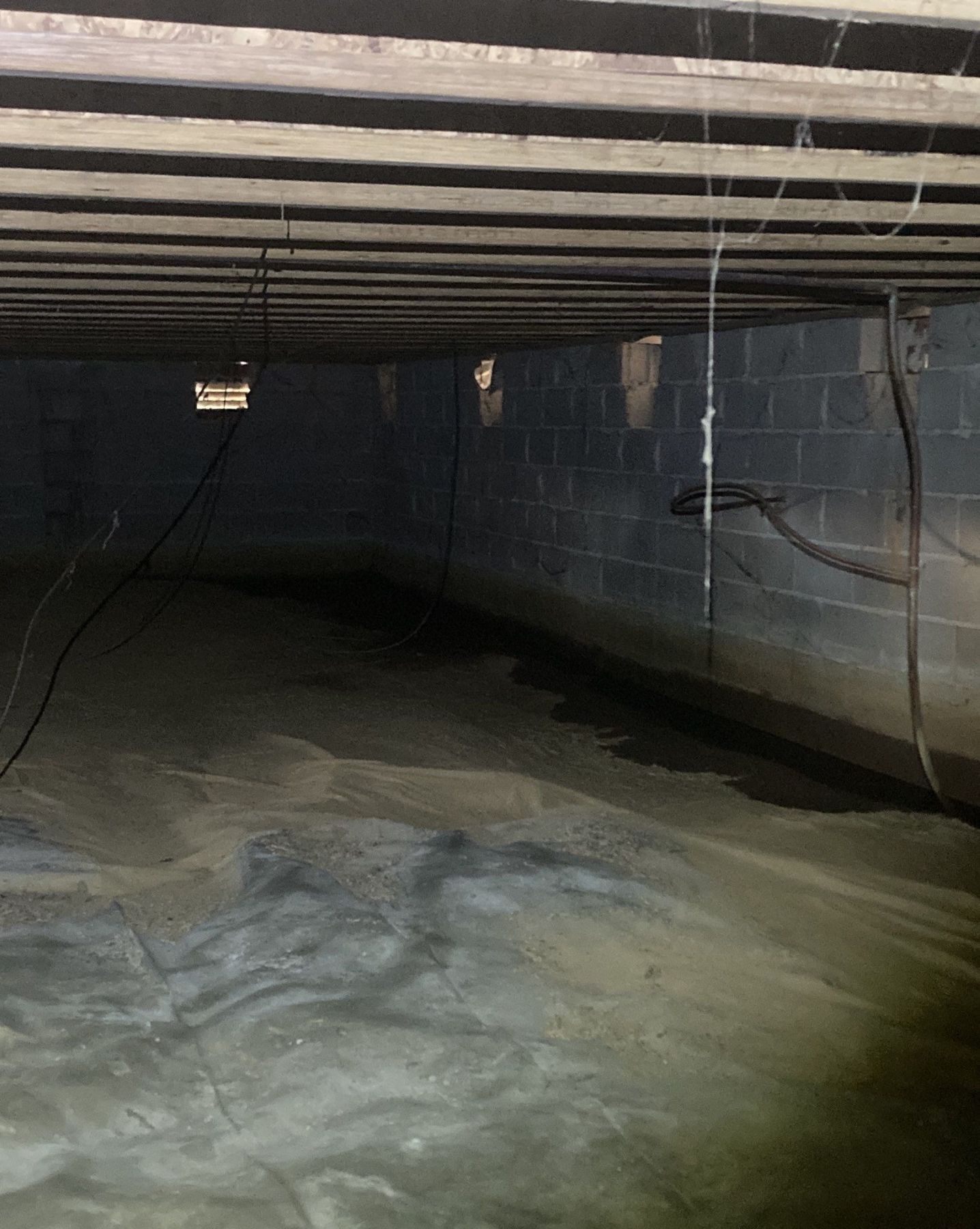 Crawlspace moisture conditions requiring investigation before encapsulation