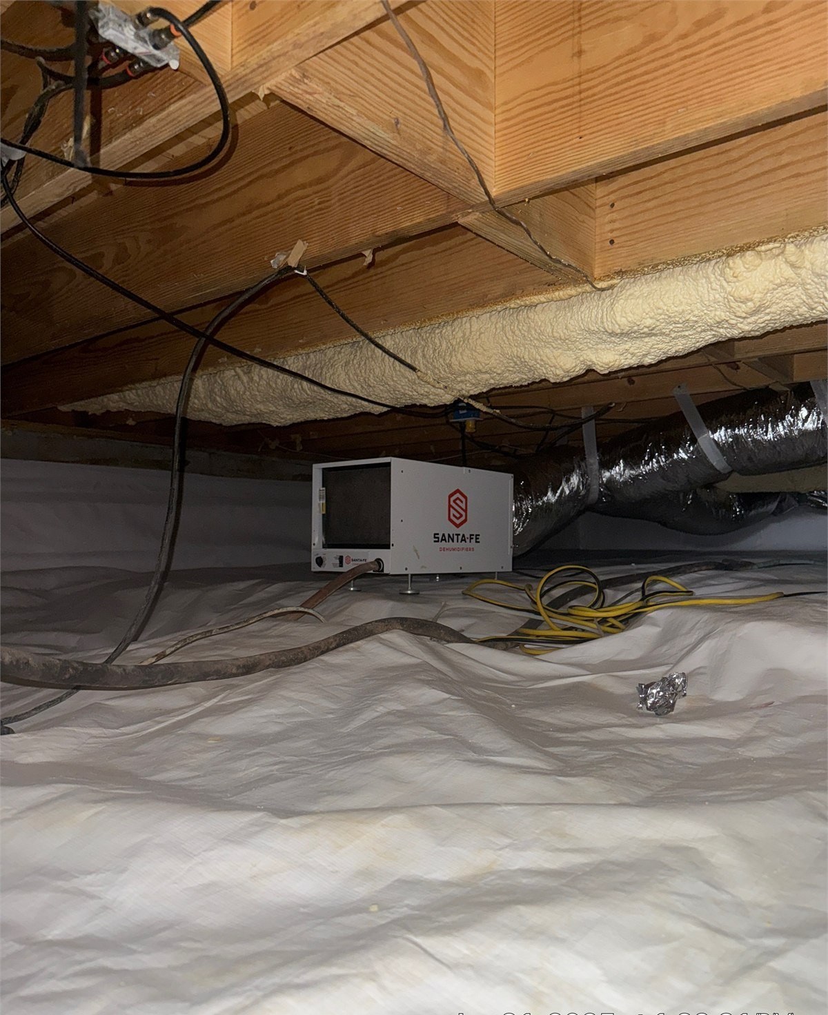 Permanent dehumidification equipment installed in an encapsulated crawlspace
