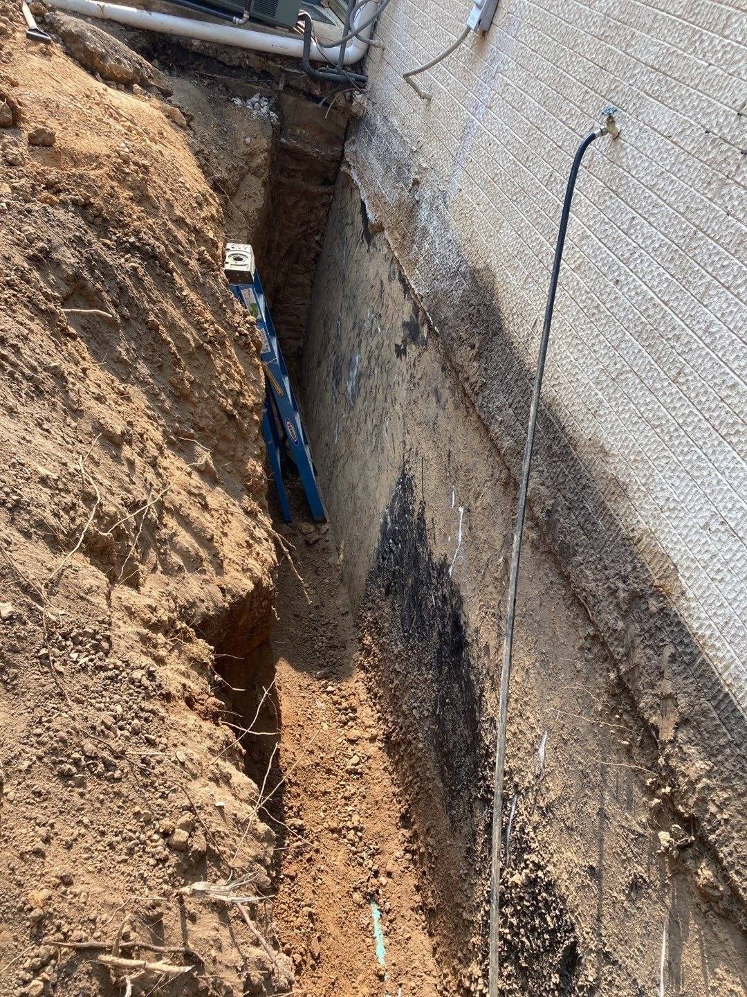 Foundation excavation for repair and waterproofing preparation, photograph 1, in Northeast Arkansas