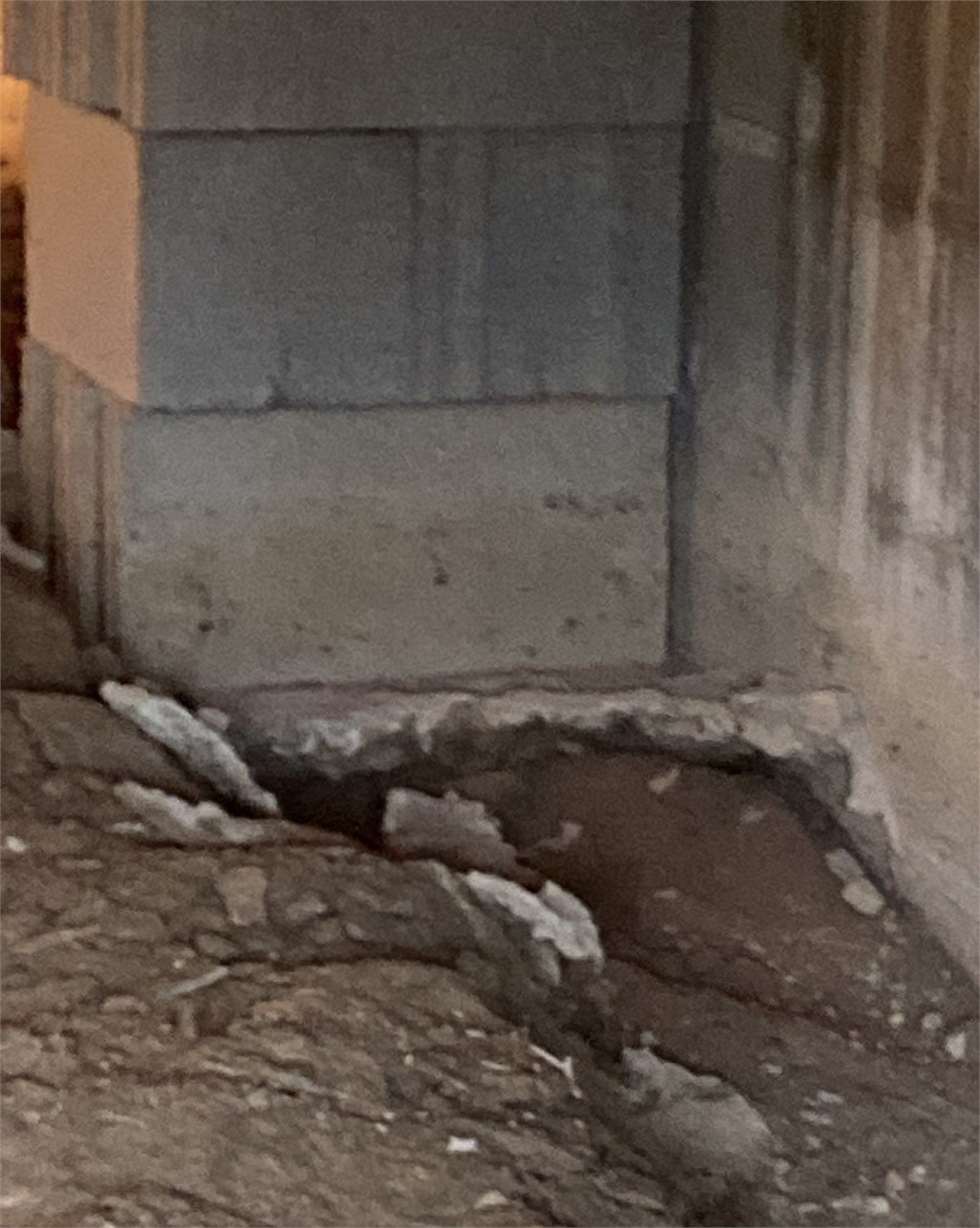 Foundation damage and soil erosion associated with water intrusion into a crawlspace