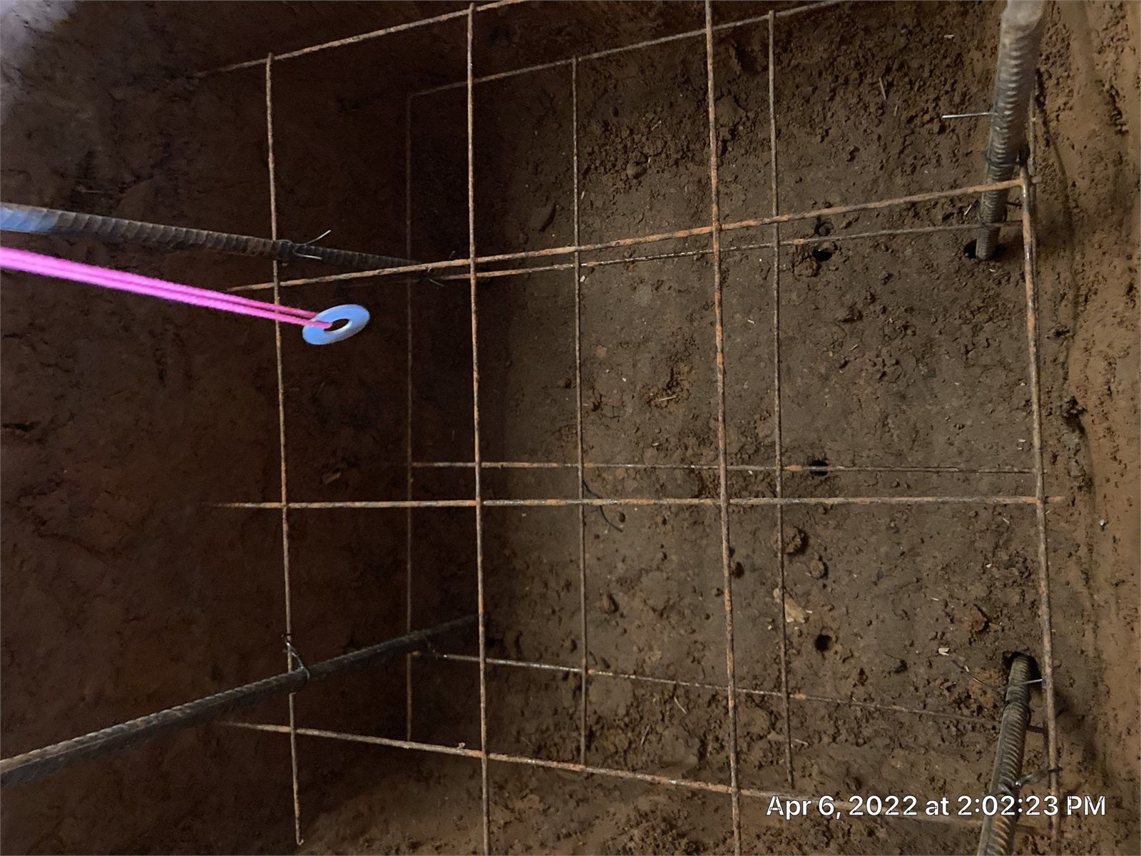 Steel reinforcement installed for a new foundation footing before concrete placement