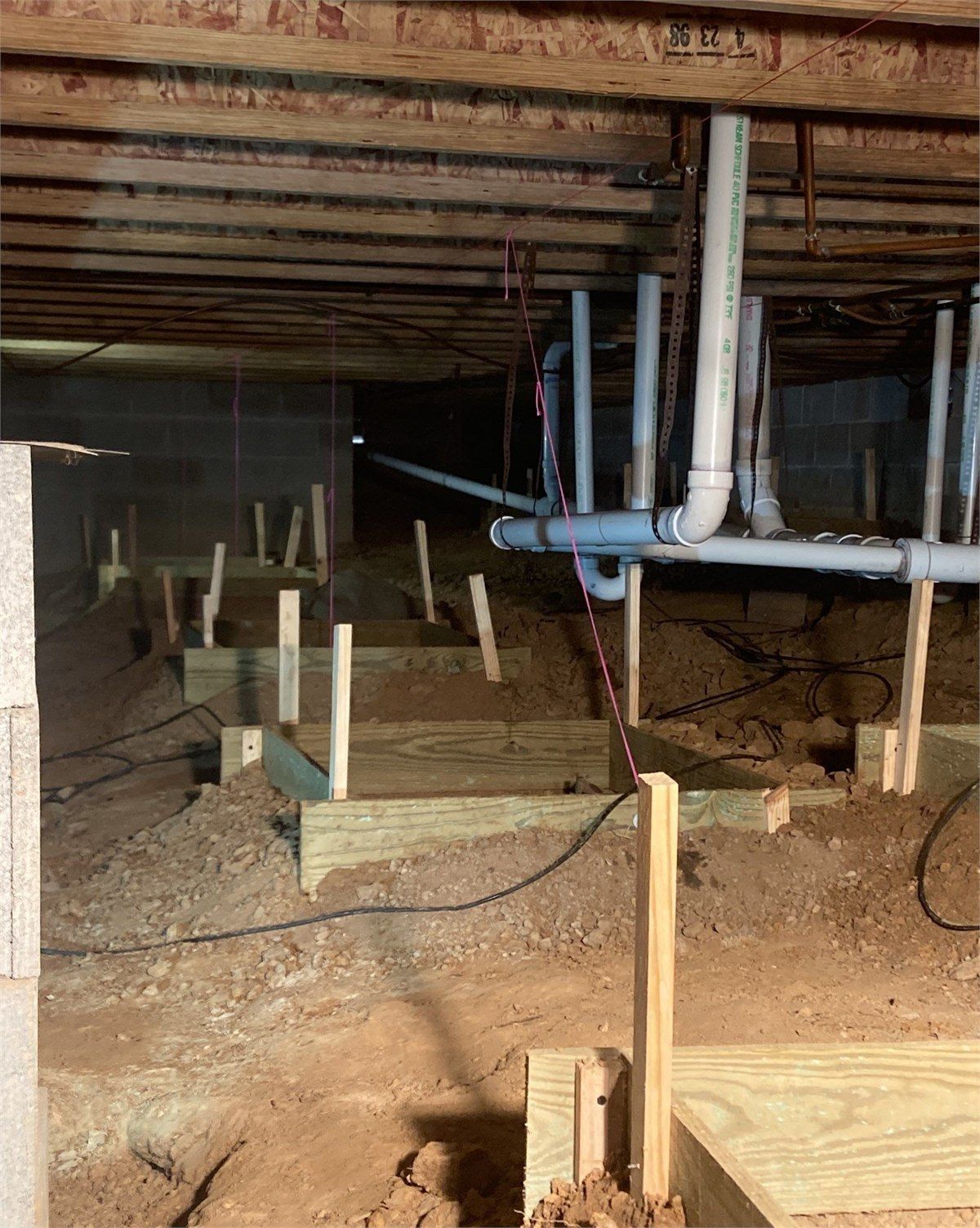 New pier foundation supports installed for structural correction and house leveling, photograph 2