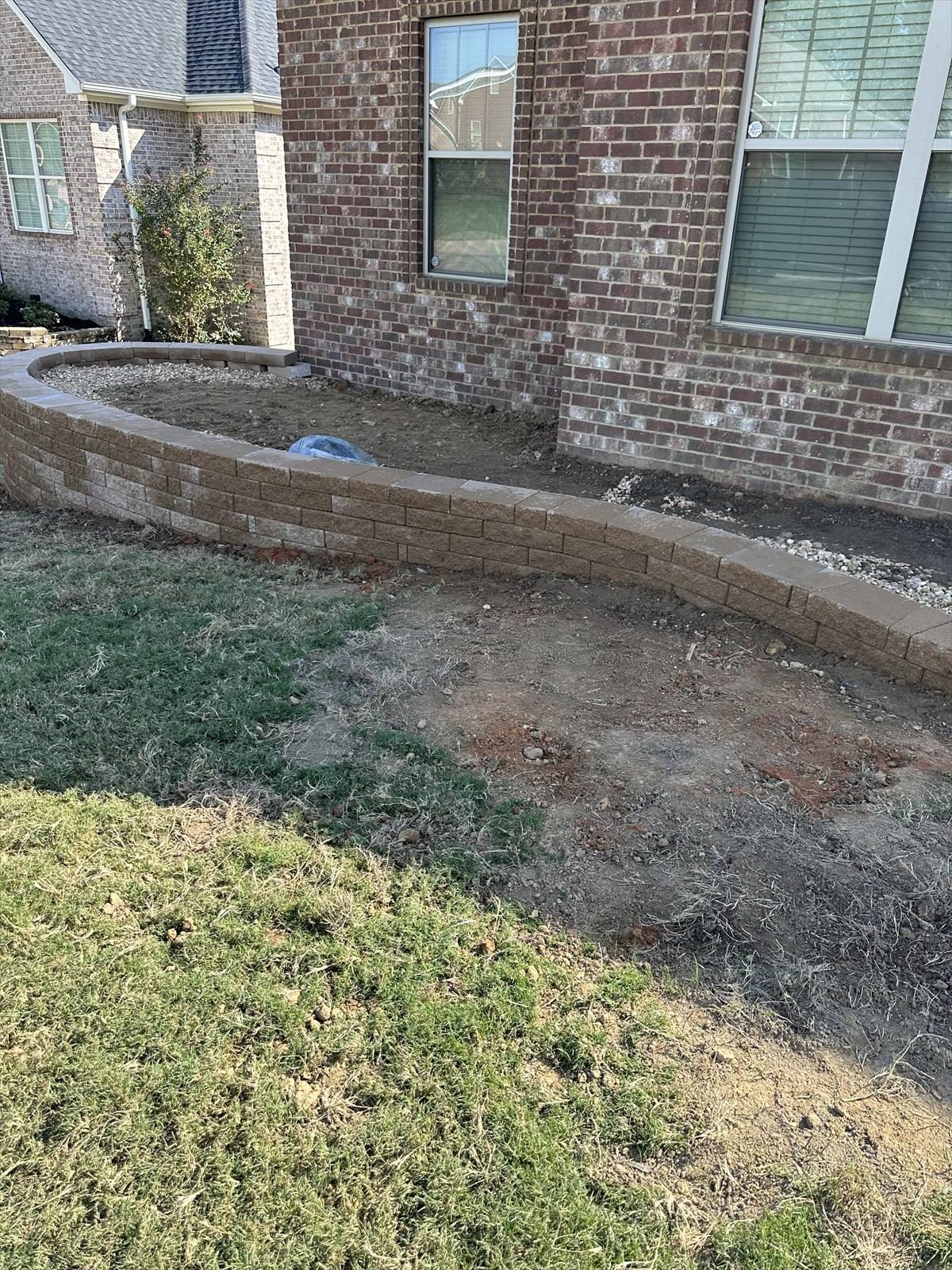 Retaining wall construction process at a Northeast Arkansas property, photograph 4