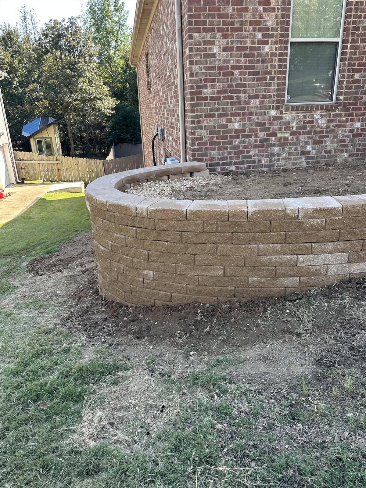 Retaining wall construction process at a Northeast Arkansas property, photograph 5