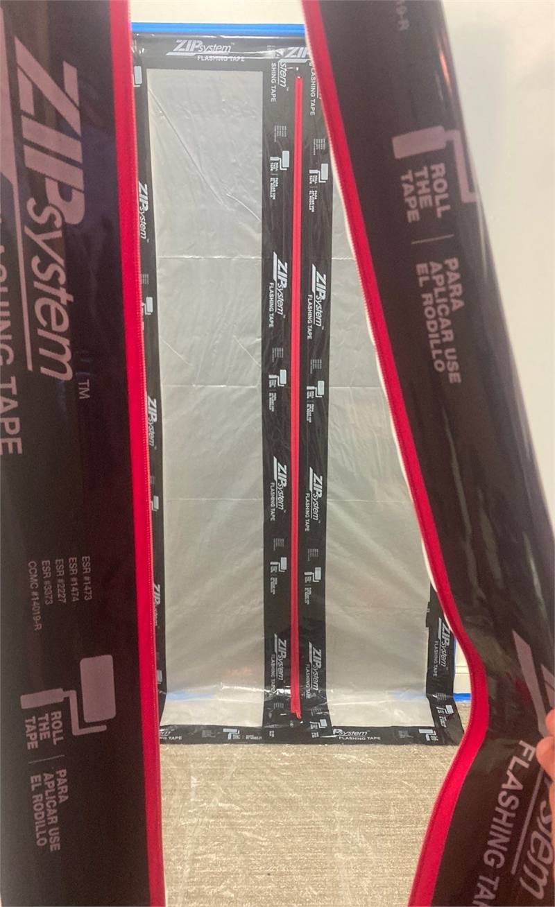 Open zipper entry showing layered containment barriers and controlled access into an isolated work area.