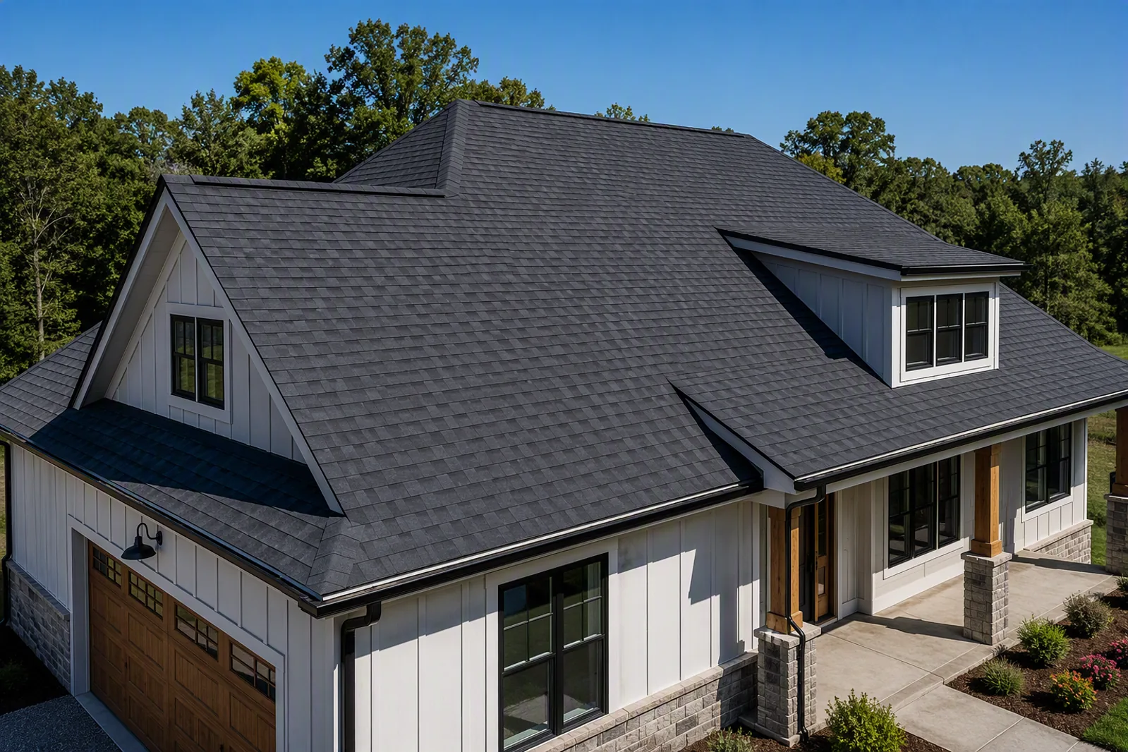 Illustration of a completed architectural asphalt shingle roof assembly with multiple roof slopes and dormers.