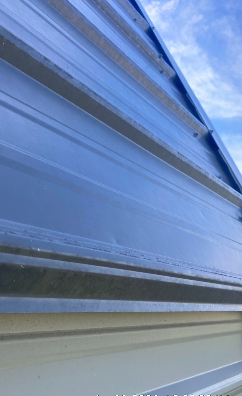 Hail impact damage to residential siding requiring exterior inspection and repair planning