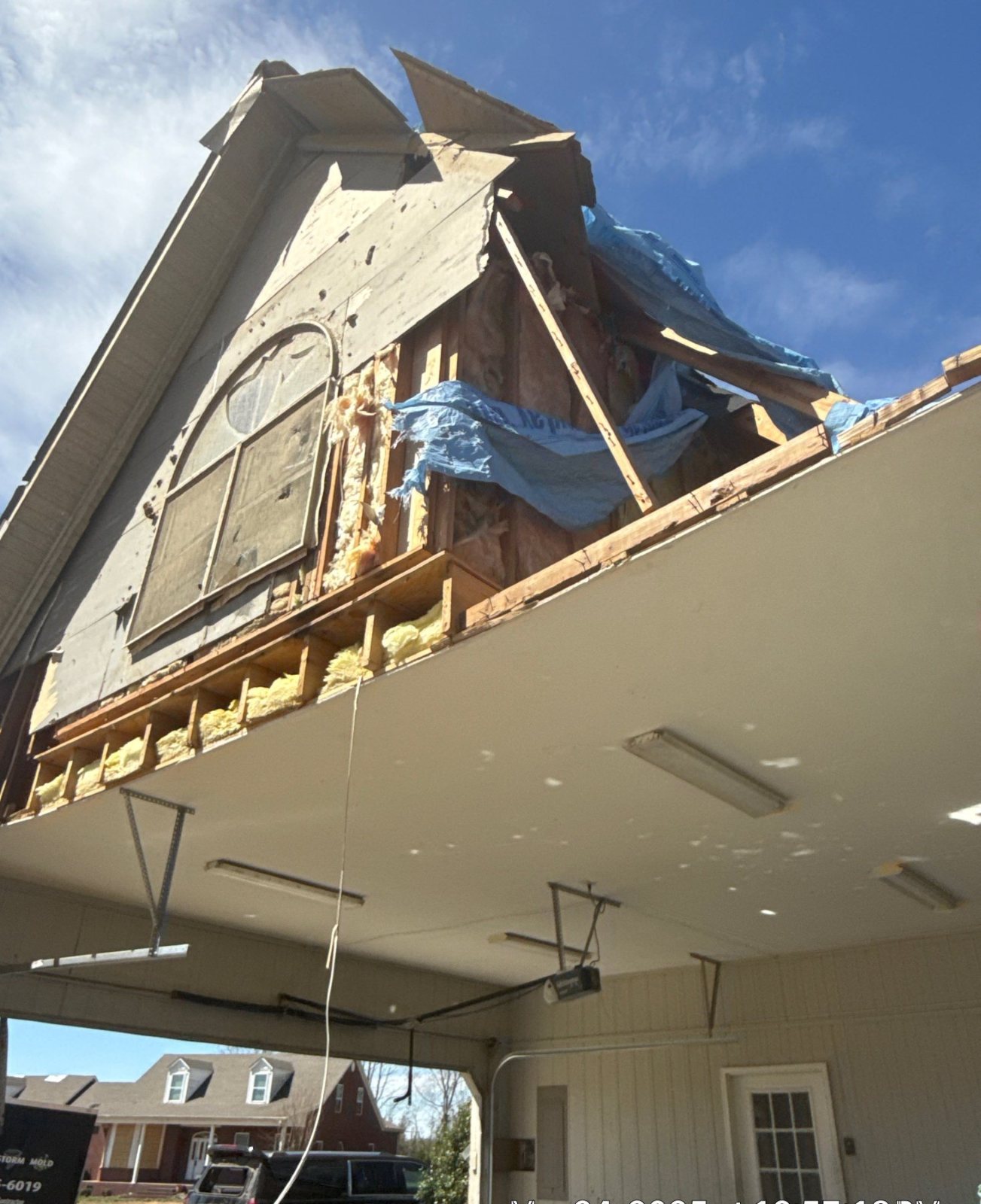 Tornado damage to a home exterior requiring stabilization and comprehensive restoration planning
