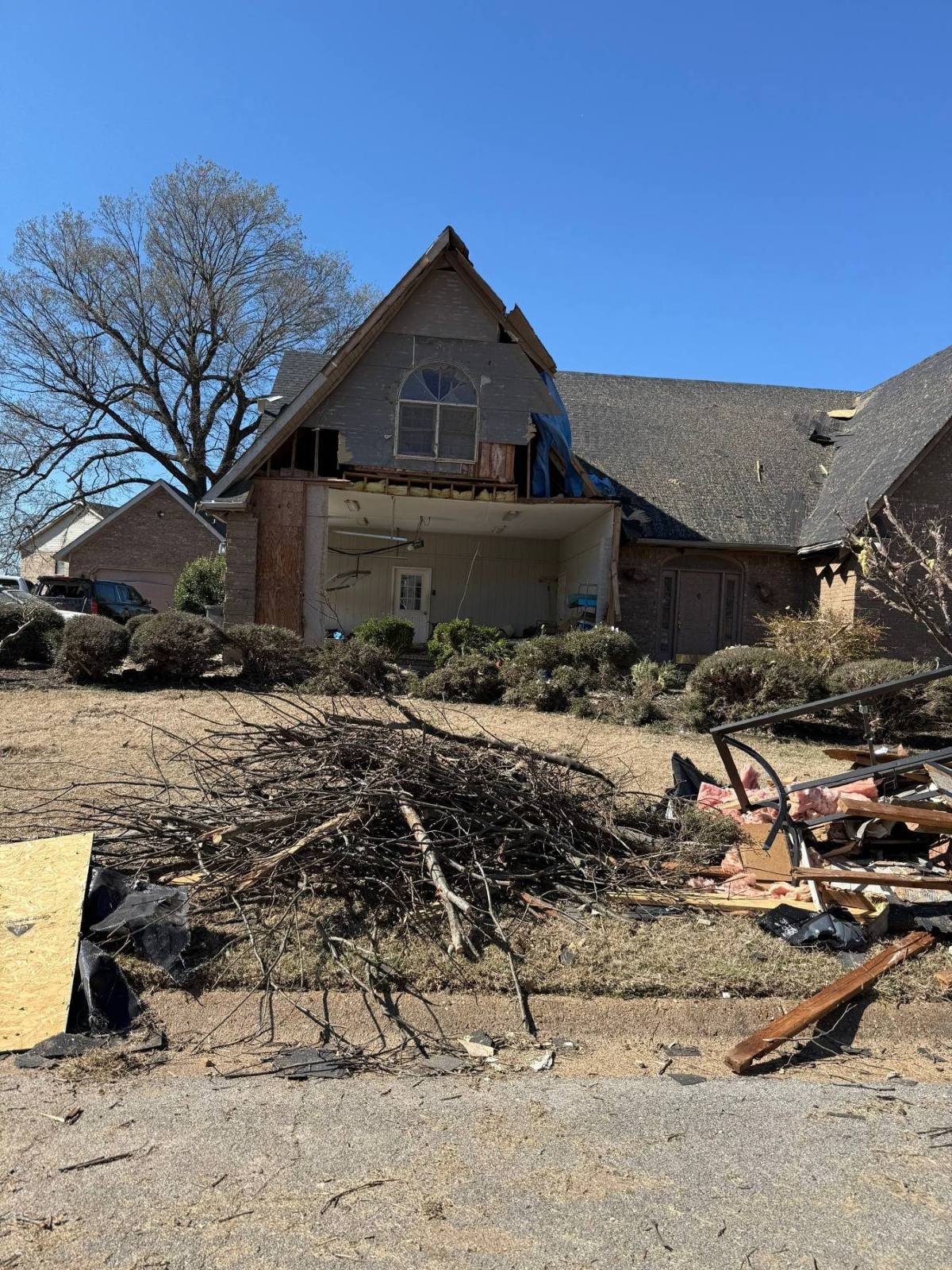 Tornado damage affecting the structure and exterior systems of a Northeast Arkansas home