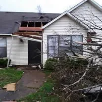Tornado-damaged house before complete restoration
