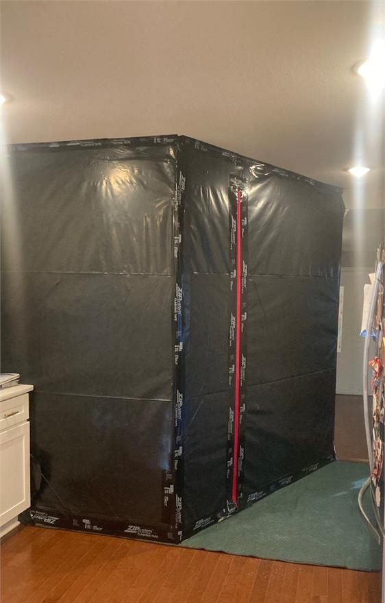 Containment system separating affected water damage work area from unaffected spaces
